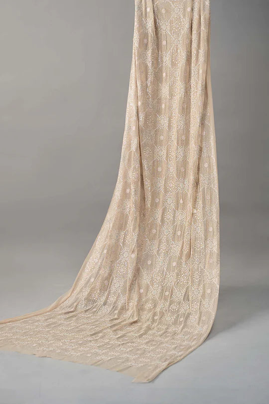 Beige textured fabric draped over a gray background