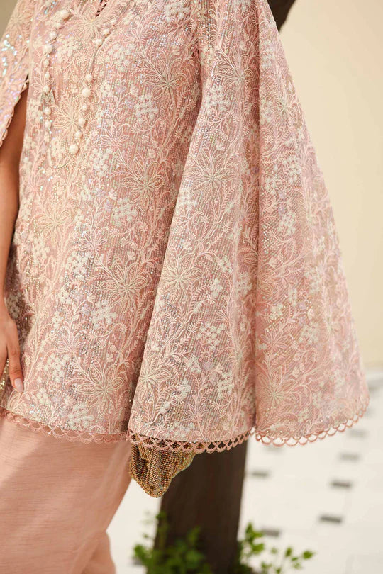 Close-up of a pink embroidered garment with a blurred background