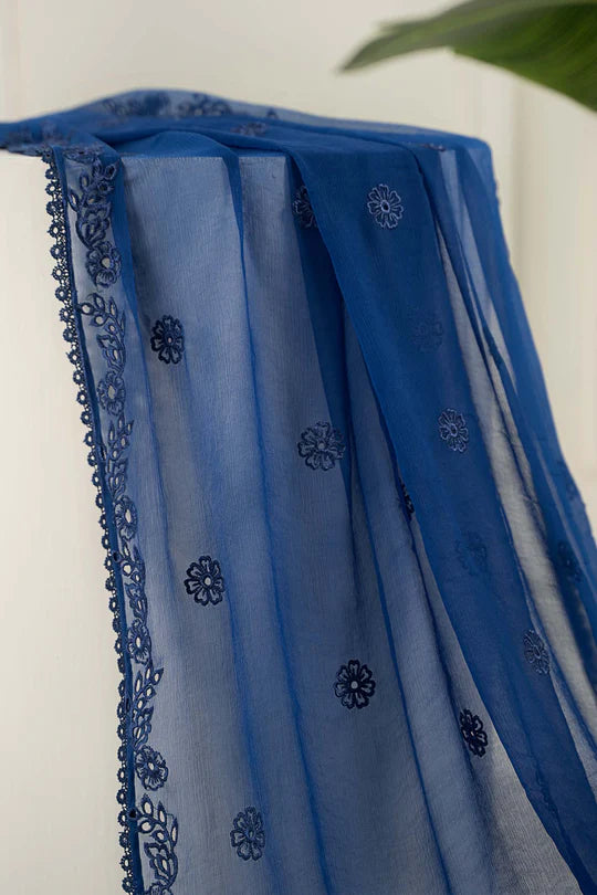 Blue fabric with intricate patterns on a white background