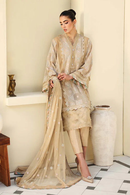 Woman in a beige traditional outfit standing in a room with decorative elements.