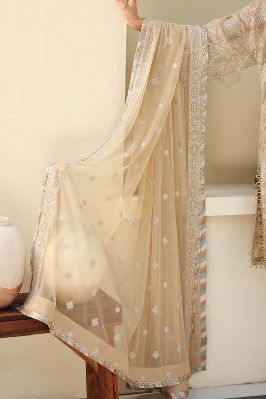 Beige embroidered saree with a plain background