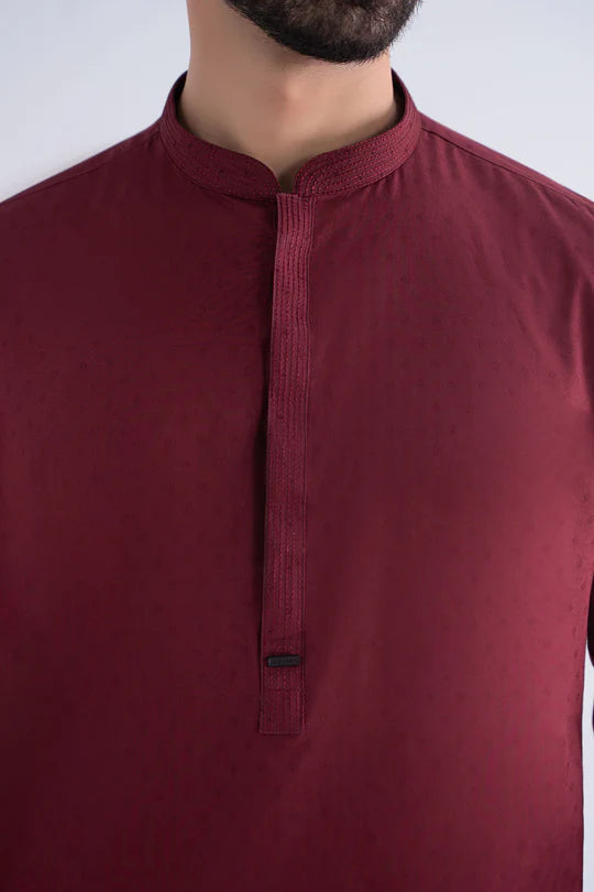 Maroon kurta worn by a person on a white background
